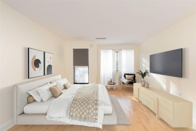 bedroom with light wood-type flooring