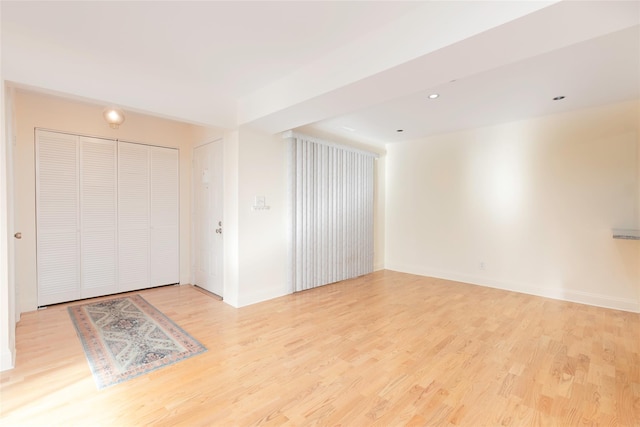 spare room with light wood-type flooring