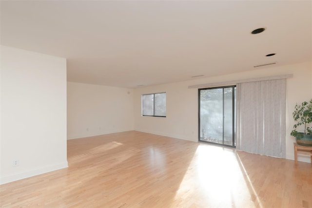 spare room with light wood-type flooring