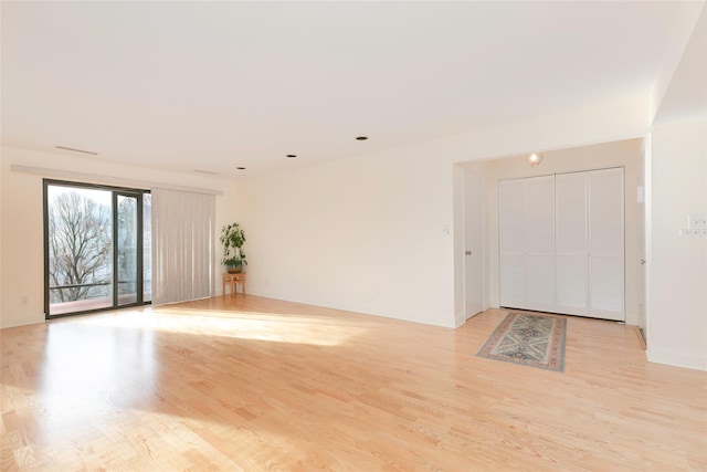 spare room featuring light hardwood / wood-style flooring