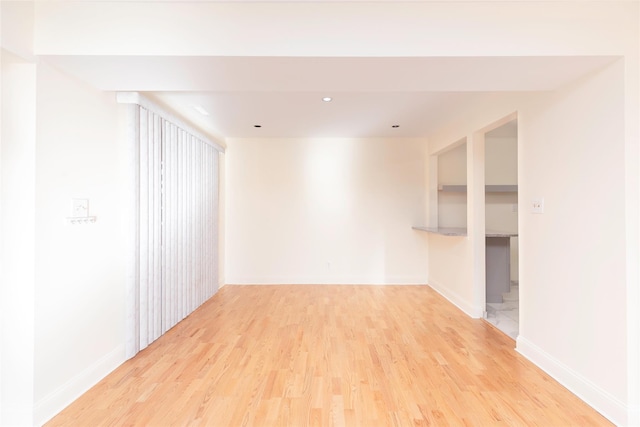 empty room with light wood-type flooring