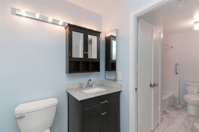 full bathroom with vanity, toilet, and tiled shower / bath combo