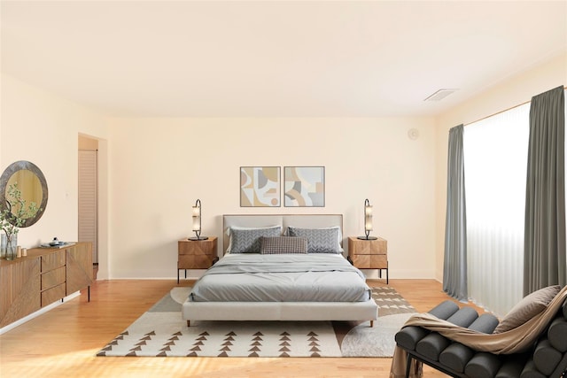 bedroom with light wood-type flooring