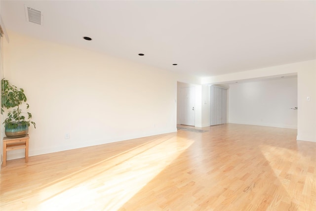 unfurnished room with light wood-type flooring