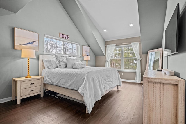 bedroom with lofted ceiling and dark hardwood / wood-style floors