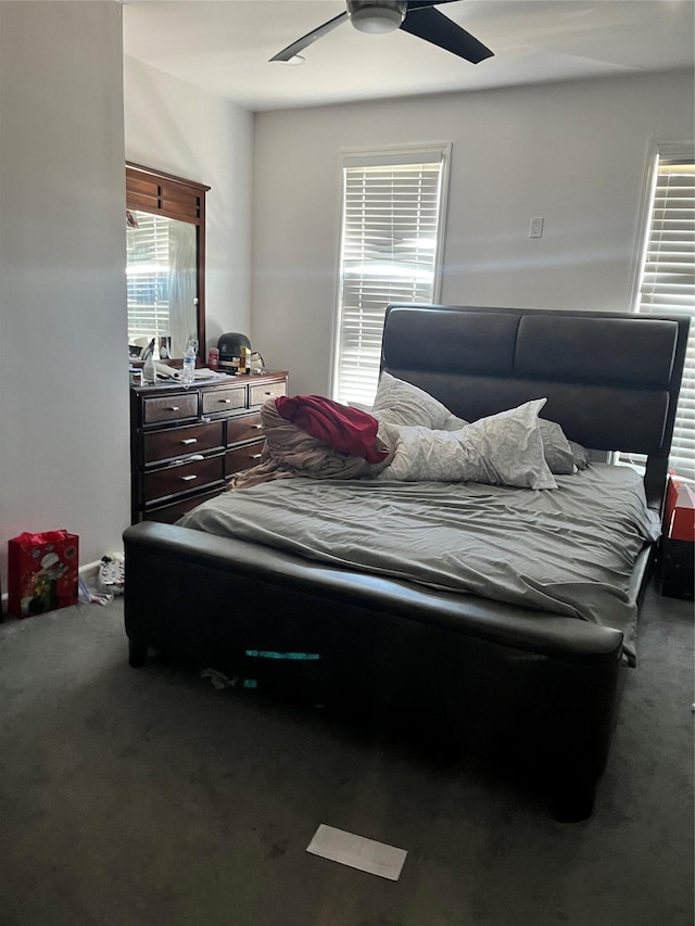 bedroom with a ceiling fan and carpet flooring