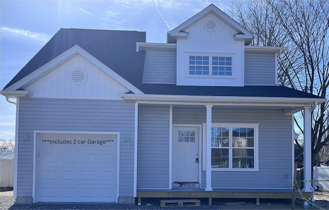 view of front facade with a garage and a porch