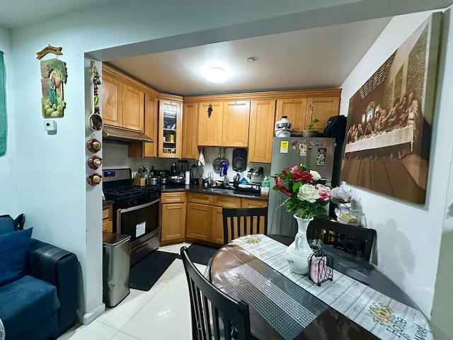 kitchen featuring sink, light tile patterned flooring, and appliances with stainless steel finishes