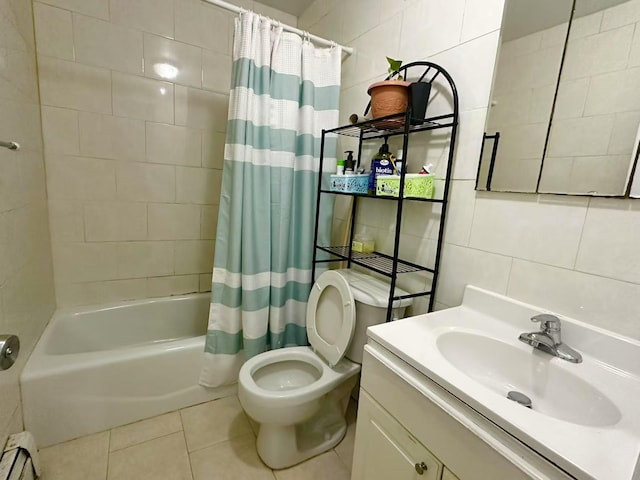 full bathroom featuring baseboard heating, backsplash, tile walls, and shower / bath combo