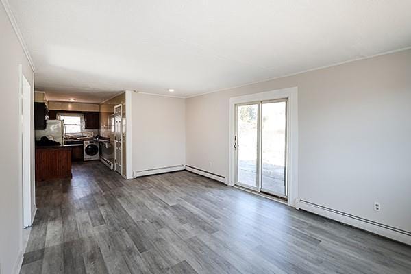 unfurnished living room with a baseboard radiator, dark wood-style flooring, and crown molding