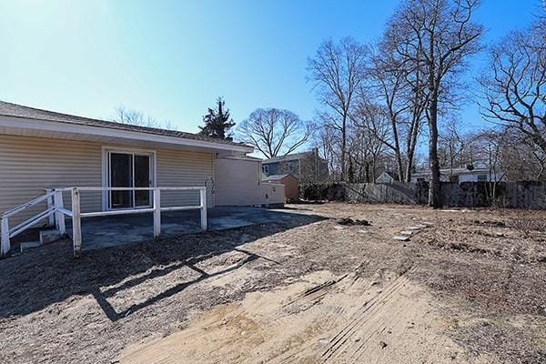 view of yard with a patio and fence