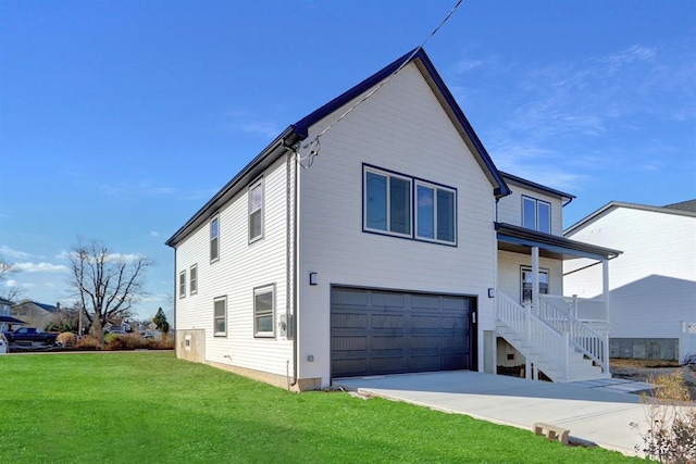 exterior space featuring a yard, a garage, and covered porch