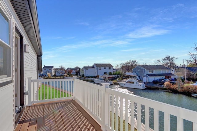 balcony featuring a deck with water view