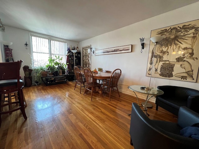 dining room with wood-type flooring