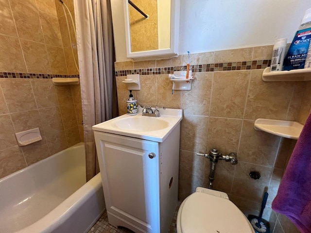 bathroom with toilet, vanity, shower / bath combination with curtain, and tile walls