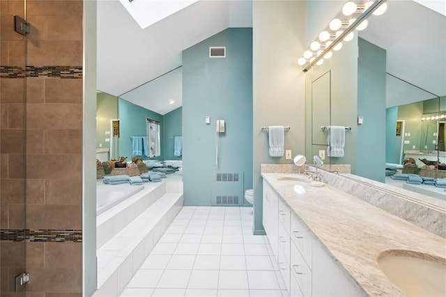 full bathroom with lofted ceiling with skylight, independent shower and bath, tile patterned flooring, vanity, and toilet