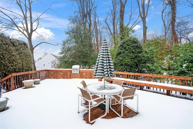 snow covered deck with area for grilling