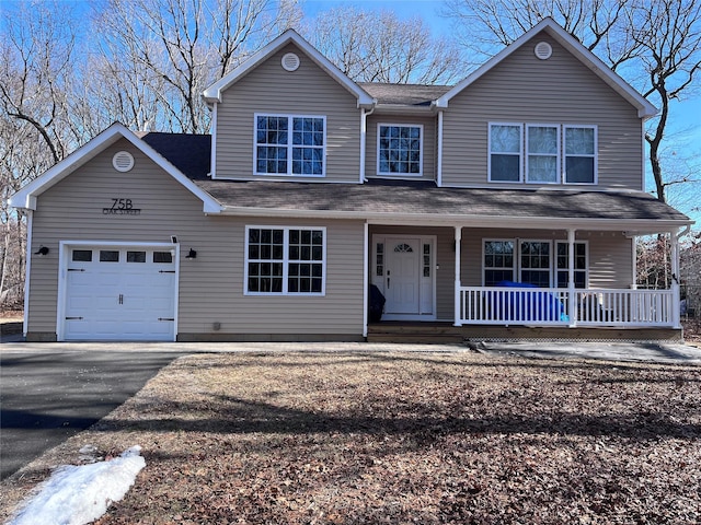 front facade with a porch and a garage