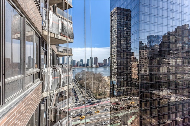 property's view of city featuring a water view