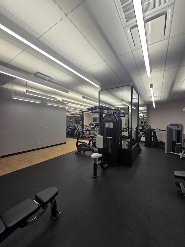 gym with a drop ceiling