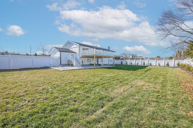 view of yard featuring a patio and a deck