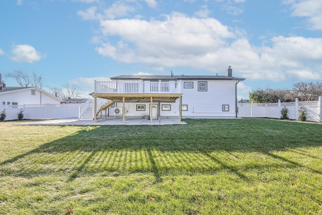 back of house with a patio, a yard, and a deck