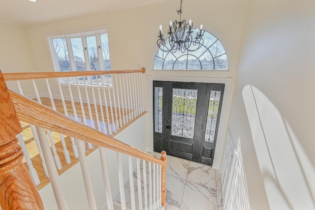 entrance foyer featuring a notable chandelier