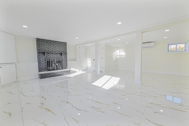 unfurnished living room featuring crown molding, a brick fireplace, and a wall mounted AC