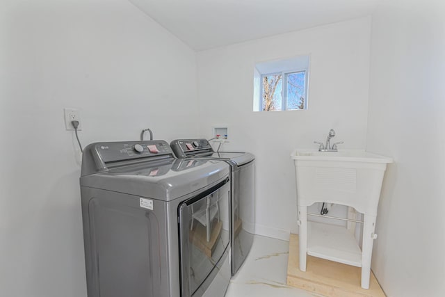 washroom with washer and dryer