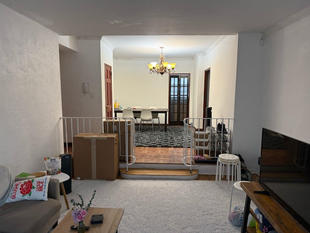 living room with a chandelier, carpet flooring, and crown molding