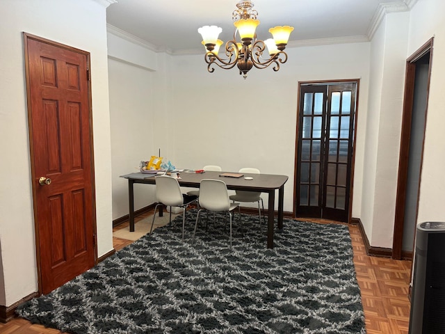 office featuring an inviting chandelier, baseboards, crown molding, and french doors