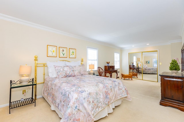 carpeted bedroom featuring ornamental molding and a closet