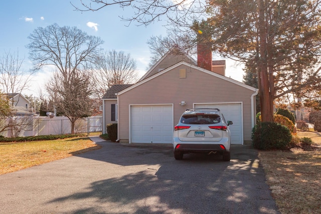 garage featuring a lawn