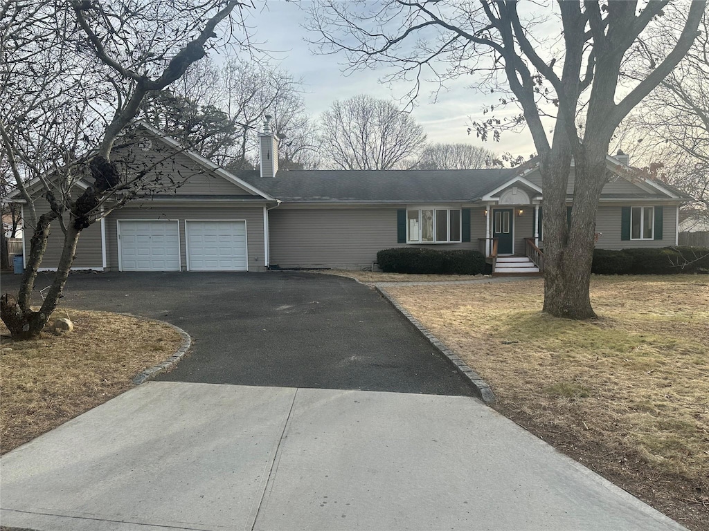 ranch-style house featuring a garage