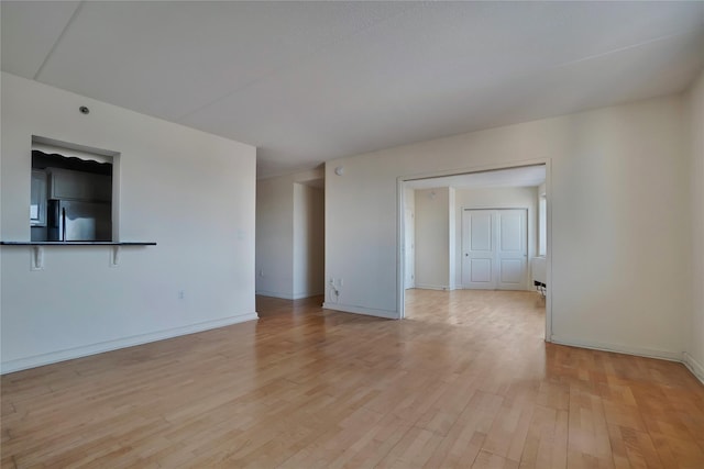 unfurnished living room with light hardwood / wood-style floors