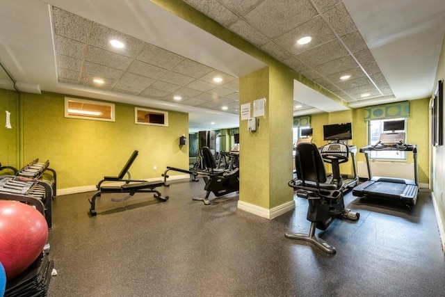 exercise room featuring a drop ceiling