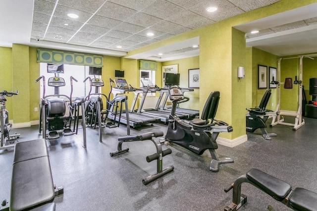 exercise room with a drop ceiling