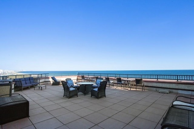 view of patio / terrace with a water view and an outdoor hangout area