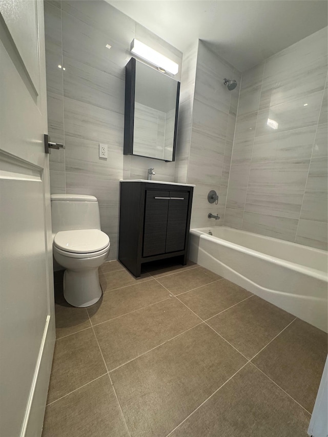 full bath with toilet, vanity, shower / tub combination, and tile patterned floors