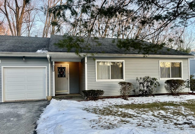 single story home featuring a garage