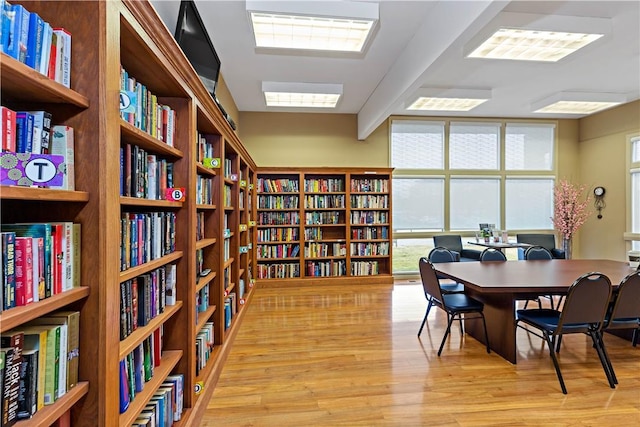 home office with light hardwood / wood-style floors