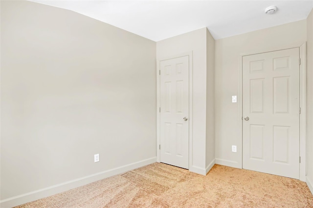 unfurnished bedroom with light carpet