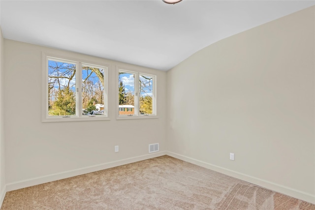 empty room featuring light carpet