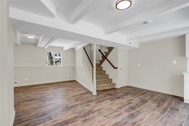 basement with dark hardwood / wood-style flooring