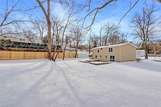 view of yard covered in snow