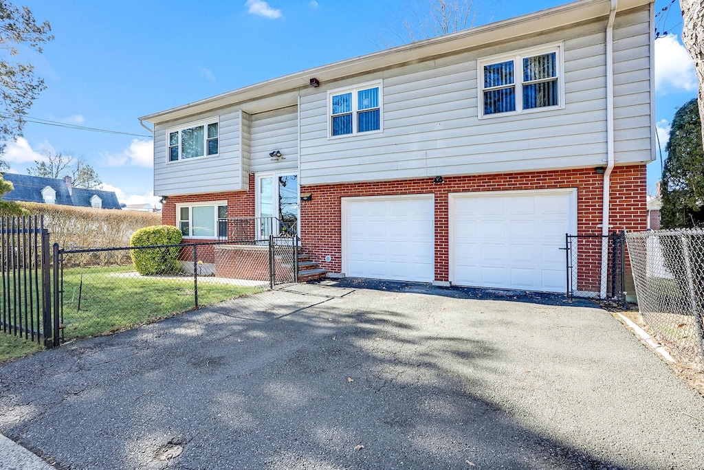 bi-level home featuring a garage