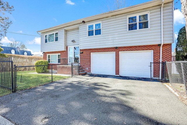 bi-level home featuring a garage