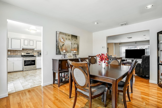 dining area with light wood-type flooring