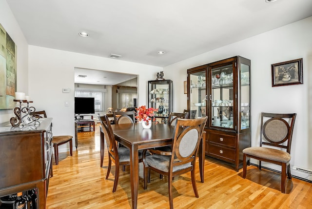 dining room with light hardwood / wood-style flooring