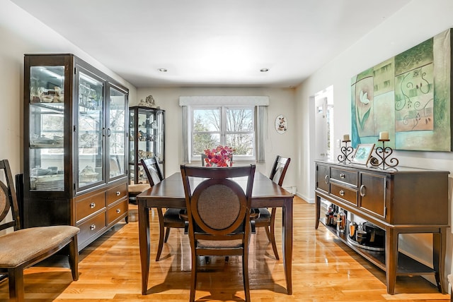 dining area with light hardwood / wood-style flooring